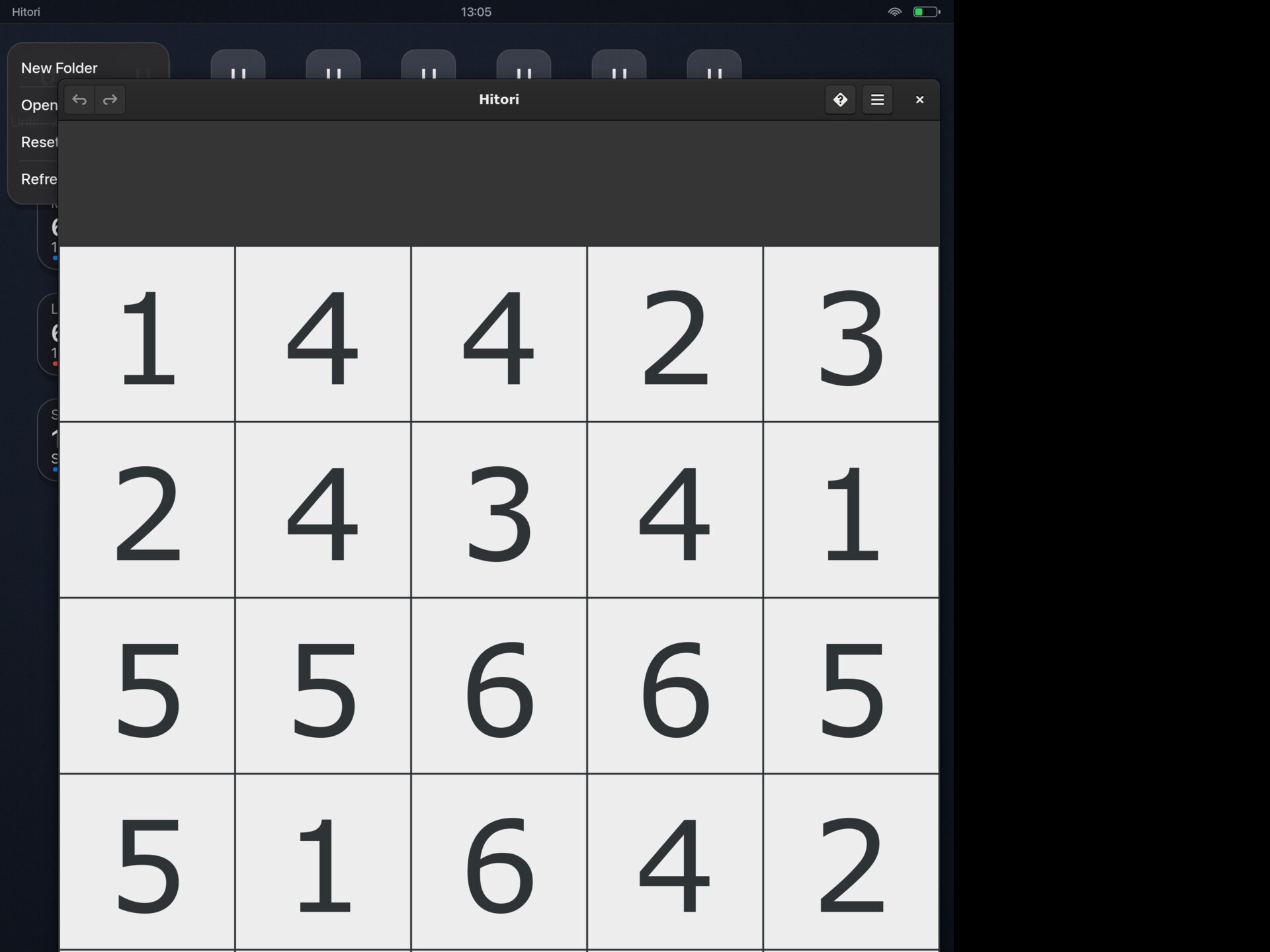 The Hitori logic puzzle running in a xiOS desktop window on a jailbroken iPad.